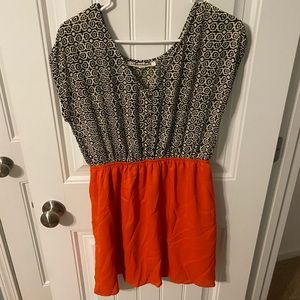 black, cream, and orange dress